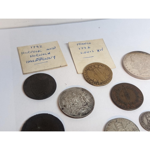 110 - A group of British and foreign late 19th/early 20th century coinage to include half crown, florin, s... 