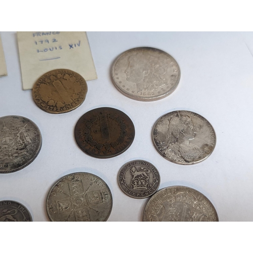 110 - A group of British and foreign late 19th/early 20th century coinage to include half crown, florin, s... 