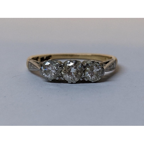 113 - An 18ct gold and platinum diamond three stone ring, 2.2g
Location: CAB6