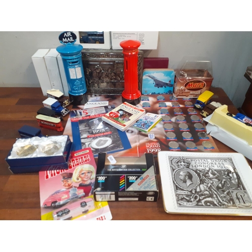 135 - Collectables to include Corgi vans, Concorde drinks mats, 1998 football collectors coins, a Matchbox... 