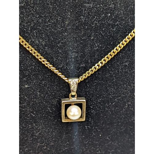 138 - A stamped 750, 18ct gold link necklace having a 9ct gold pendant inset with a seed pearl and a pair ... 