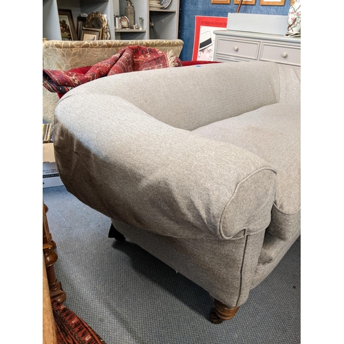 158 - A Chesterfield sofa with grey upholstery and on turned legs and castors, 77h x 208w x 96d
Location: ... 