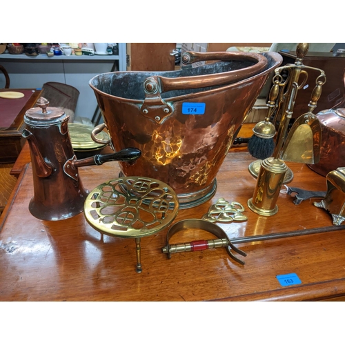 174 - A selection of Victorian and later copper and brassware to include a copper coal bucket, coffee pot ... 