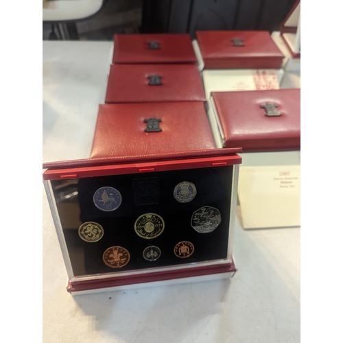 182 - A group of nine UK uncirculated coins sets to include UK proof coins collection 1992, 1994-97, along... 