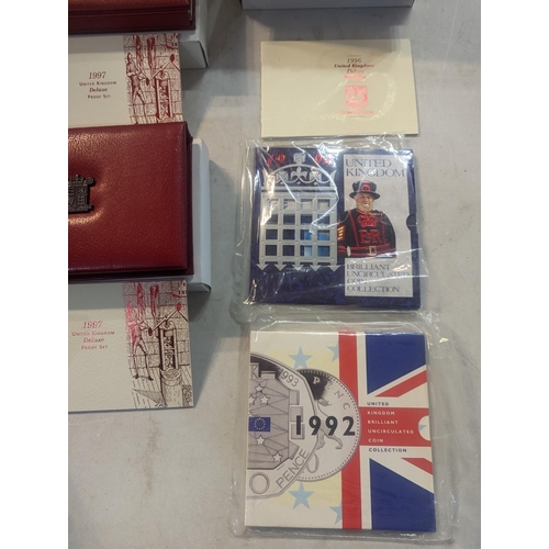 182 - A group of nine UK uncirculated coins sets to include UK proof coins collection 1992, 1994-97, along... 