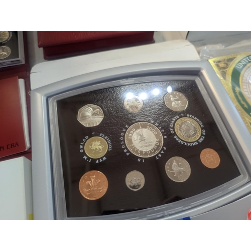 187 - A group of eight UK uncirculated coin sets to include UK Deluxe Proof sets 1998-2002, along with Bri... 