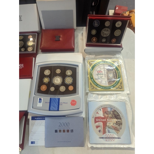 187 - A group of eight UK uncirculated coin sets to include UK Deluxe Proof sets 1998-2002, along with Bri... 