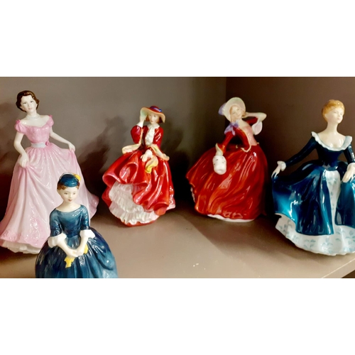 197 - A quantity of bone china figures to include Royal Doulton Top of the Hill HN1834 and an earlier Top ... 