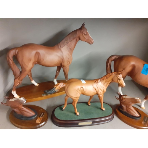 206 - Late 20th century bisque models of race horses to include a Beswick The Minstrel racing horse of the... 