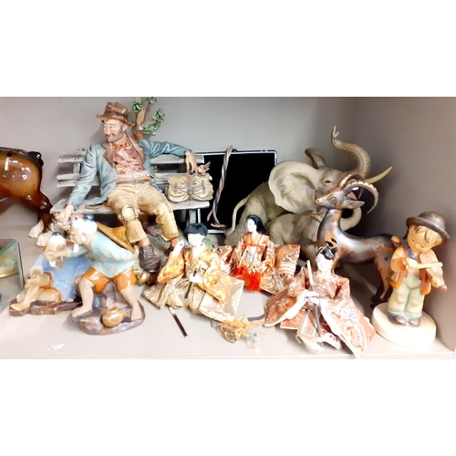 208 - Collectables to include a signed Capodimonte figure seated on a bench signed Voeta, a Vaga Internati... 