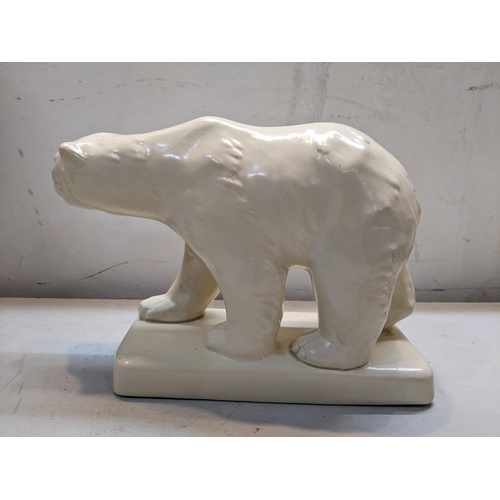 21 - A large Beswick model of a polar bear, numbered 417, 16cm h x 26cm w
Location: 9:1