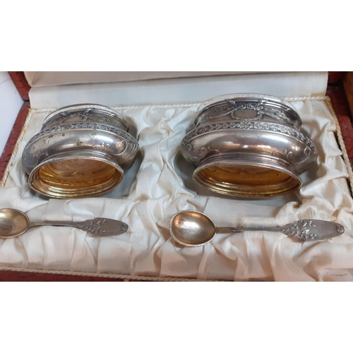 212 - A cased pair of white metal cruets with spoons, together with decorative boxes, collectables and fla... 