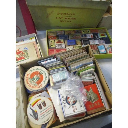 241 - A mixed lot of vintage match boxes, beer mats, cheese labels etc, along with a booklet of Players Co... 