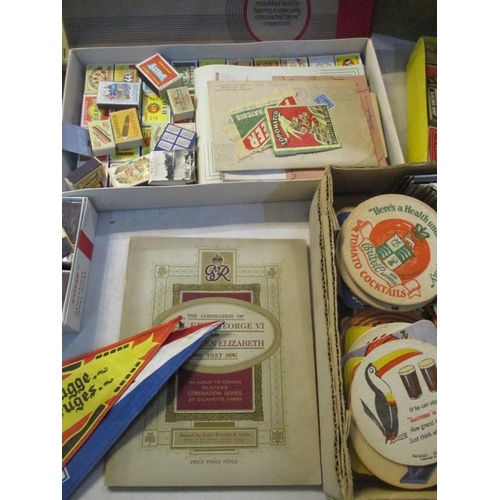 241 - A mixed lot of vintage match boxes, beer mats, cheese labels etc, along with a booklet of Players Co... 