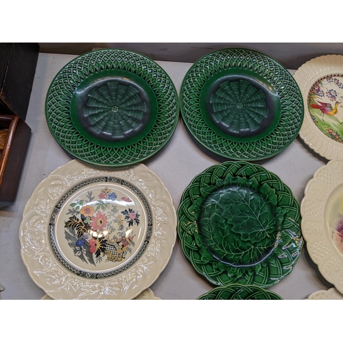 25 - Four Victorian Majolica plates to include a pair of Minton lattice plates, together with four Coalpo... 