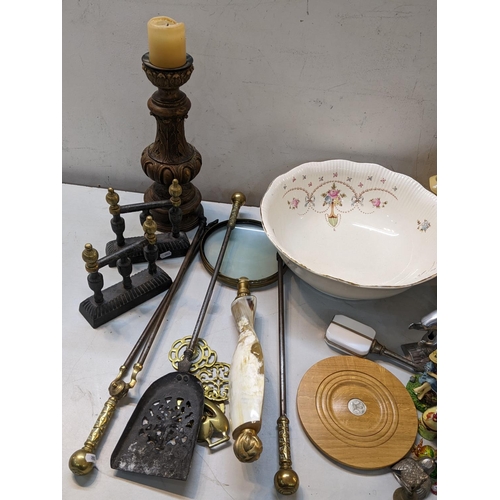 36 - A mixed lot to include Victorian fire irons, resin pricket stand, wash bowl, nut cracker and other i... 