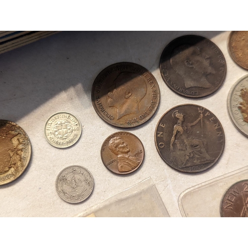 56 - Mixed British coinage to include 'Whitman' coin folders of pennies, half pennies, brass threepence a... 