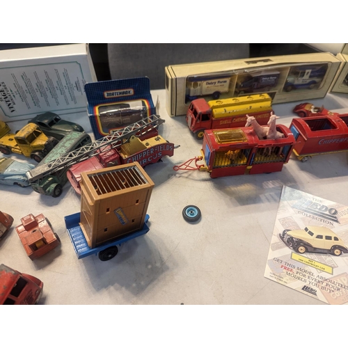 59 - A group of vintage toy cars to include Dinky military vehicles, Corgi Chipperfields Circus vehicles ... 