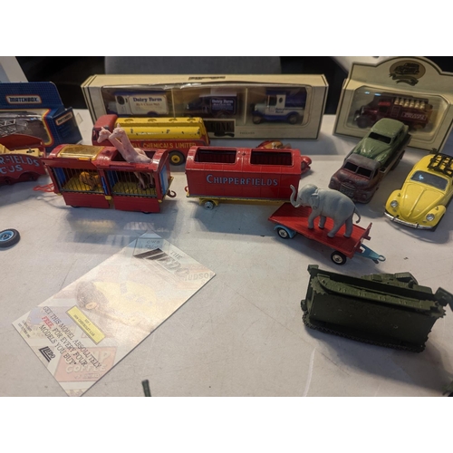 59 - A group of vintage toy cars to include Dinky military vehicles, Corgi Chipperfields Circus vehicles ... 