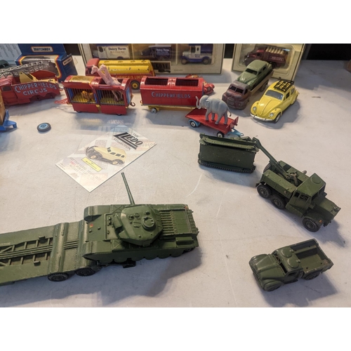 59 - A group of vintage toy cars to include Dinky military vehicles, Corgi Chipperfields Circus vehicles ... 