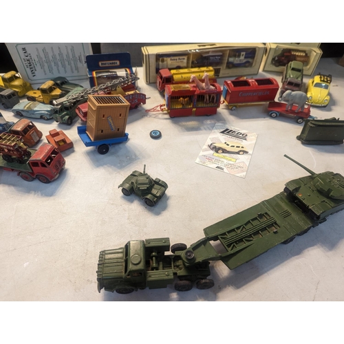 59 - A group of vintage toy cars to include Dinky military vehicles, Corgi Chipperfields Circus vehicles ... 