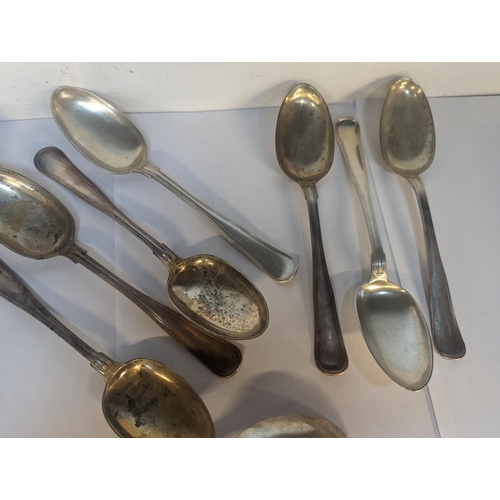 82 - A group of eleven mixed silver Danish tablespoons, having various monograms and some stamped, Prahl,... 