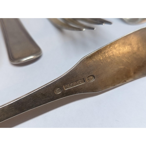 84 - A group of nine Danish silver spoons and forks to include four spoons and five forks stamped W. Solv... 