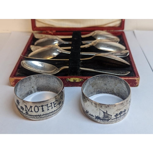 91 - Six mixed silver teaspoons and two Egyptian Niello silver napkin rings
Location: TABLE