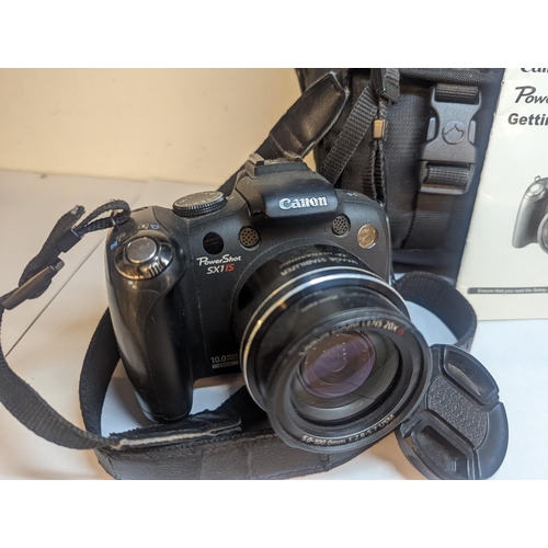 92 - A pair of Canon camera A/F to include a Canon Powershot 5 x 40 HS and a Power Shot S x 1 15, Locatio... 