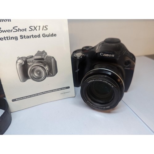 92 - A pair of Canon camera A/F to include a Canon Powershot 5 x 40 HS and a Power Shot S x 1 15, Locatio... 