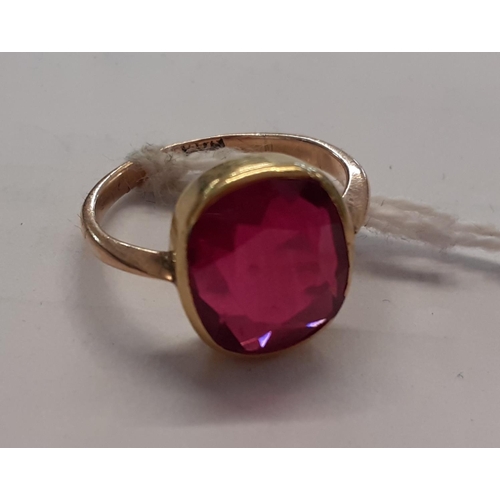 115 - A 9ct gold ring inset with a large ruby, 3.4g
Location: CAB6