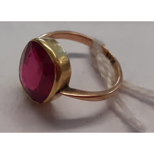 115 - A 9ct gold ring inset with a large ruby, 3.4g
Location: CAB6