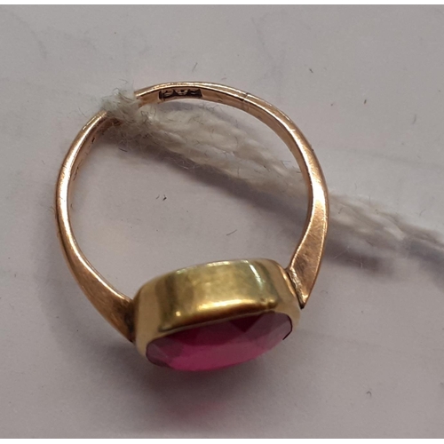 115 - A 9ct gold ring inset with a large ruby, 3.4g
Location: CAB6