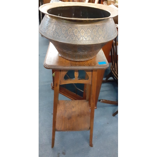 62 - An early 20th century coal purdonium together with an early 20th century plant stand, brass jardiniè... 