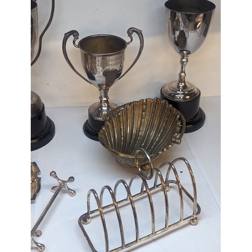 95 - Mixed silver plate and metalware to include a toast rack, trophies and other items
Location: A2F