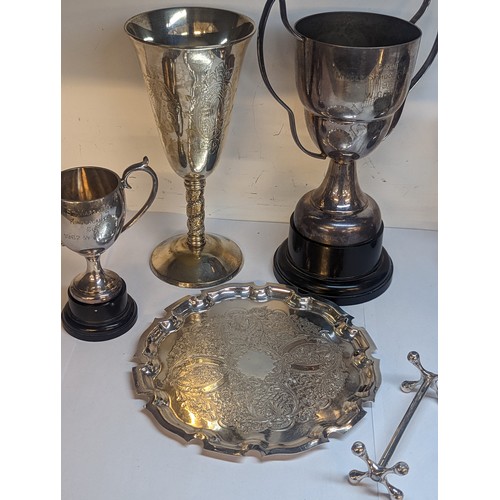 95 - Mixed silver plate and metalware to include a toast rack, trophies and other items
Location: A2F