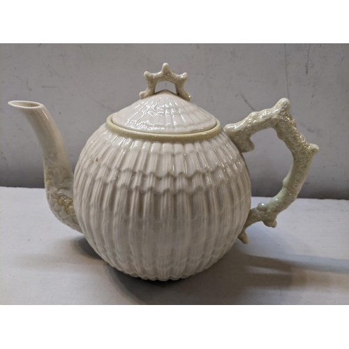 275 - A Belleek Limpet pattern teapot,  Location: 7.1