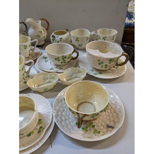 278 - A selection of Belleek Clover pattern china to include a moustache cup, milk jugs, cups and saucer a... 