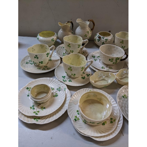 278 - A selection of Belleek Clover pattern china to include a moustache cup, milk jugs, cups and saucer a... 