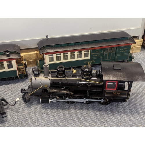 363 - A large gauge Bachmann plastic model railway to include locomotive tender, two carriages, track and ... 