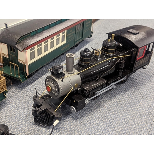 363 - A large gauge Bachmann plastic model railway to include locomotive tender, two carriages, track and ... 