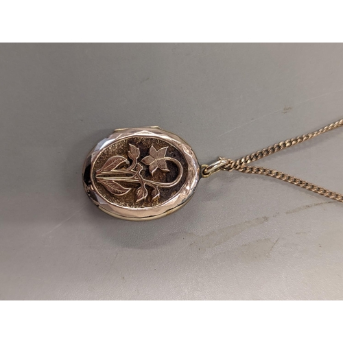 375 - THIS LOT IS WITHDRAWN: - A 9ct gold curb link necklace having a gold plated locket with floral decor... 