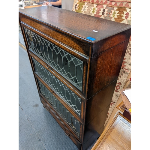 405 - An early 20th century oak three tier Globe Wernicke style bookcase with drawer below, 128h x 87w
Loc... 