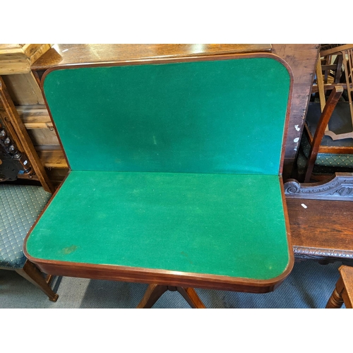 423 - A Regency mahogany foldover card table with a green baize and four splayed legs, 72h x 91w
Location:... 