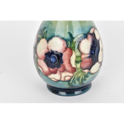 100 - A Walter Moorcroft pottery vase in the 'Anemone' pattern, of baluster form with tube-lined pink/purp... 