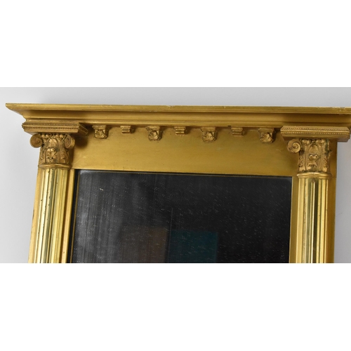 168 - A pair of regency style mirrors, with rectangular plates framed by giltwood flanking reeded columns ... 