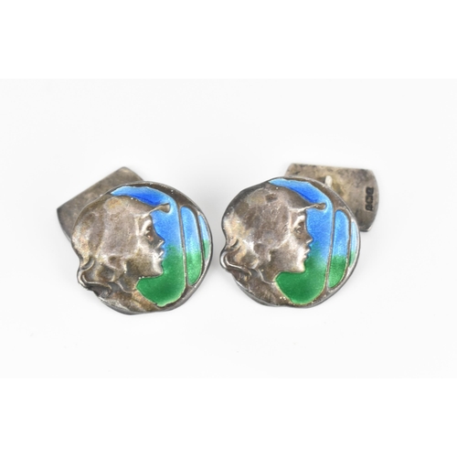 178 - A pair of silver and enamel Art Nouveau style cuff links, of circular form with hammered silver prof... 