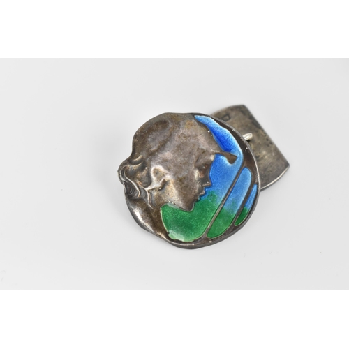 178 - A pair of silver and enamel Art Nouveau style cuff links, of circular form with hammered silver prof... 