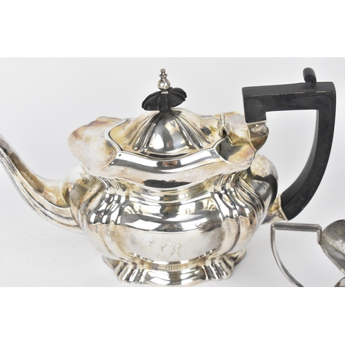 179 - A boxed Edwardian four piece silver tea/coffee set by Marks & Cohen, Birmingham 1907, comprising a t... 