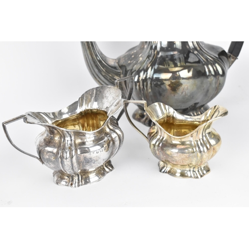 179 - A boxed Edwardian four piece silver tea/coffee set by Marks & Cohen, Birmingham 1907, comprising a t... 